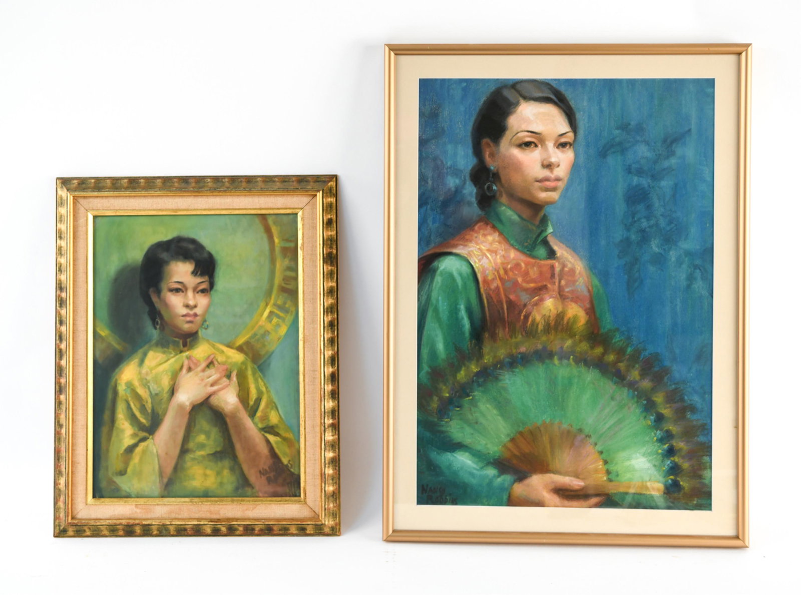 (2) ART DECO PASTELS IN CHINESE COSTUME, SIGNED: Portraits in pastel of women in Chinese dress. Both signed Nancy Robbins. Dimensions: (Frame) H 27" x W 19.5" (Sight) H 23" x W 15.5" Condition: Pastels clean, rubbing to frames.