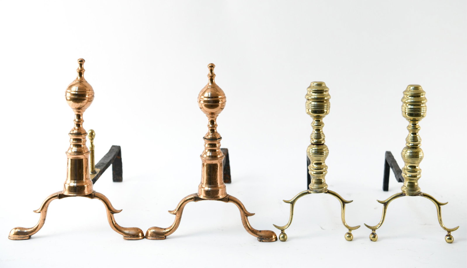 GROUPING OF ANDIRONS: Two pairs. Dimensions: (Taller) H 14.5" x W 10.5" x D 16.5" Condition: Showing signs of use including corrosion and tarnish.