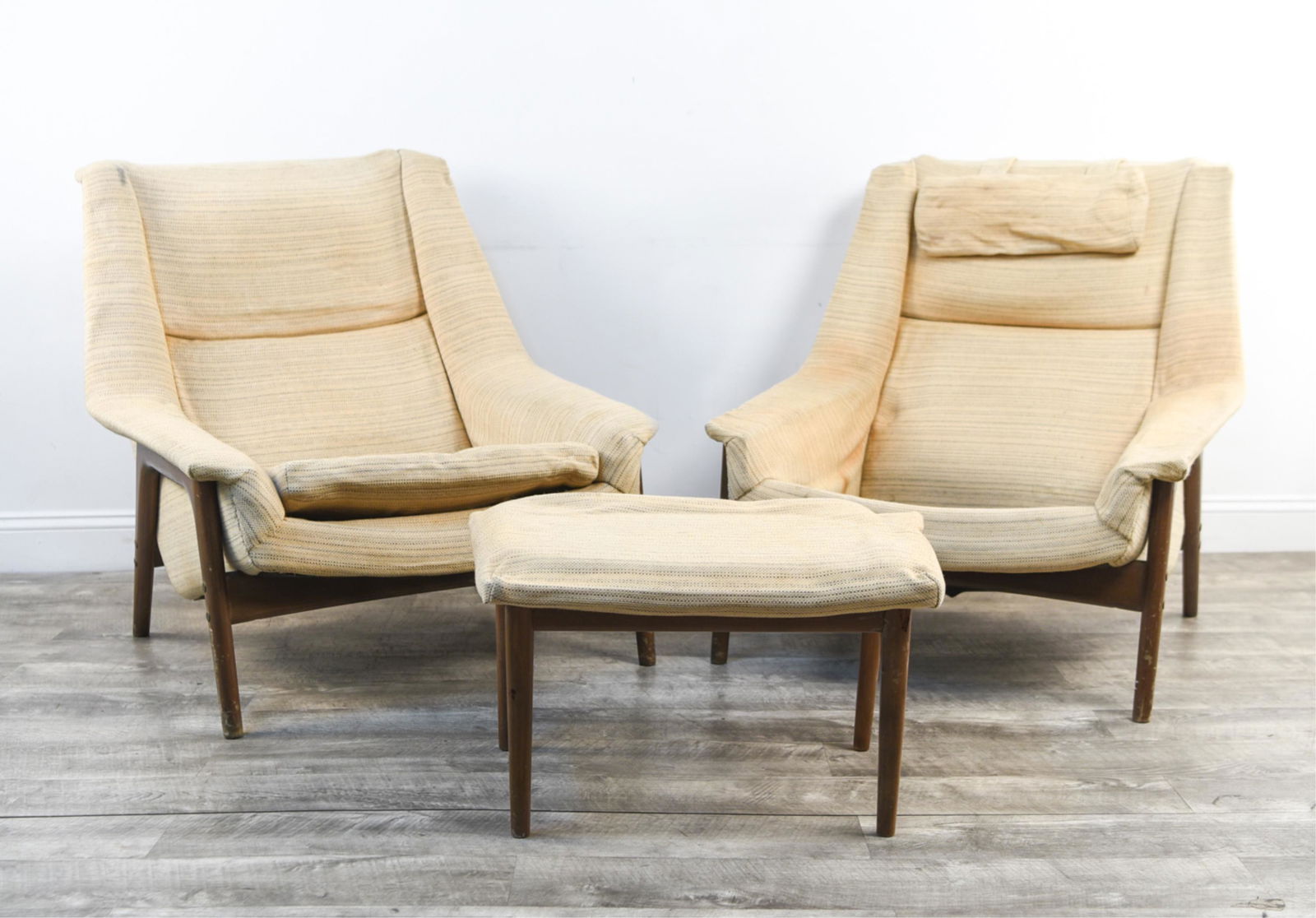 FOLKE OHLSSON FOR DUX LOUNGE CHAIRS & OTTOMAN: Dimensions: (Chair) H 35" x W 33.25" x D 31" x SH 16.5" Condition: As is. Soiling, fading, and wear to upholstery. One missing seat cushion, one missing head pillow. Marks, wear, and losses to wood fr