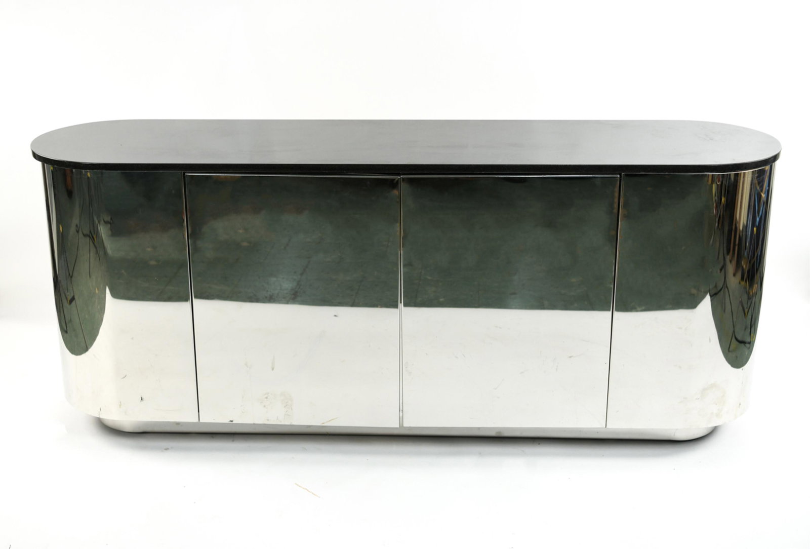 ATTR. J. WADE FOR BRUETON CHROME MARBLE SIDEBOARD: Chrome-clad sideboard, black granite top, finished on all sides, no markings. Dimensions: H 30" x W 73" x D 18.75" Condition: Few small dings including couple light rubs and scratches.