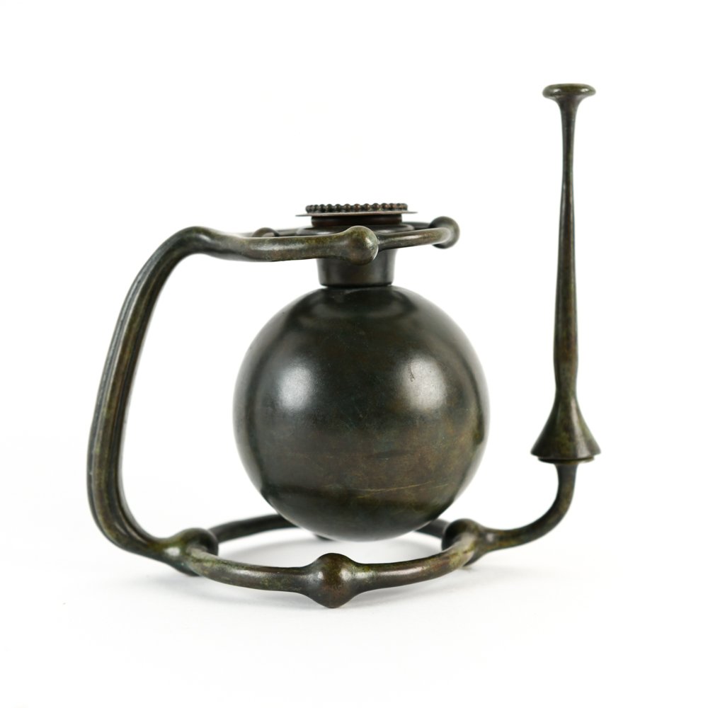 TIFFANY STUDIOS GIMBAL CANDLE STICK HOLDER: Monogrammed and marked, Tiffany Studios. Dimensions: H 7.25" x W 8" x D 4.25" Condition: Light handling wear.