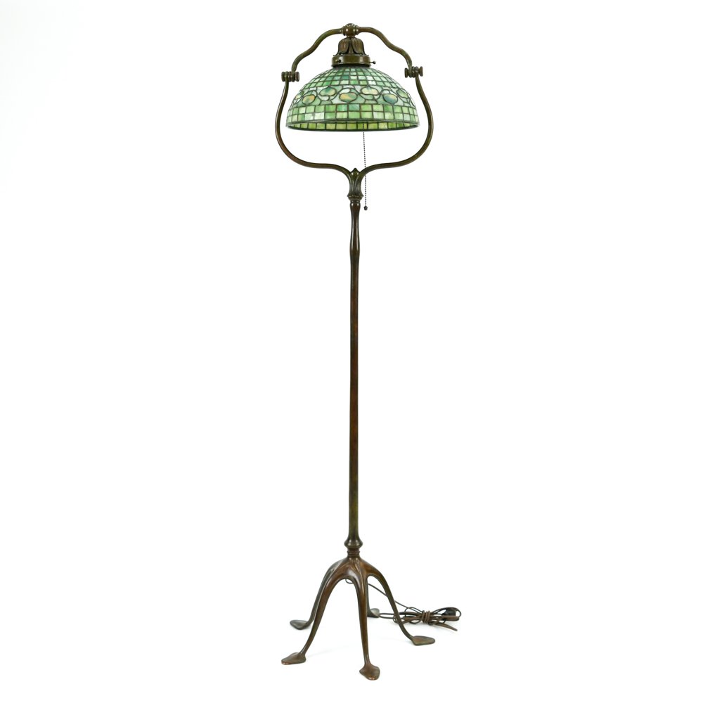 TIFFANY FLOOR LAMP W/ACORN SHADE: Bronze and glass, marked on interior trim of shade, Tiffany Studios New York. Marked on bottom of lamp foot, Tiffany Studios New York, 423H.Dimensions: H 58" x D 15.5"Condition: Showing very light sig