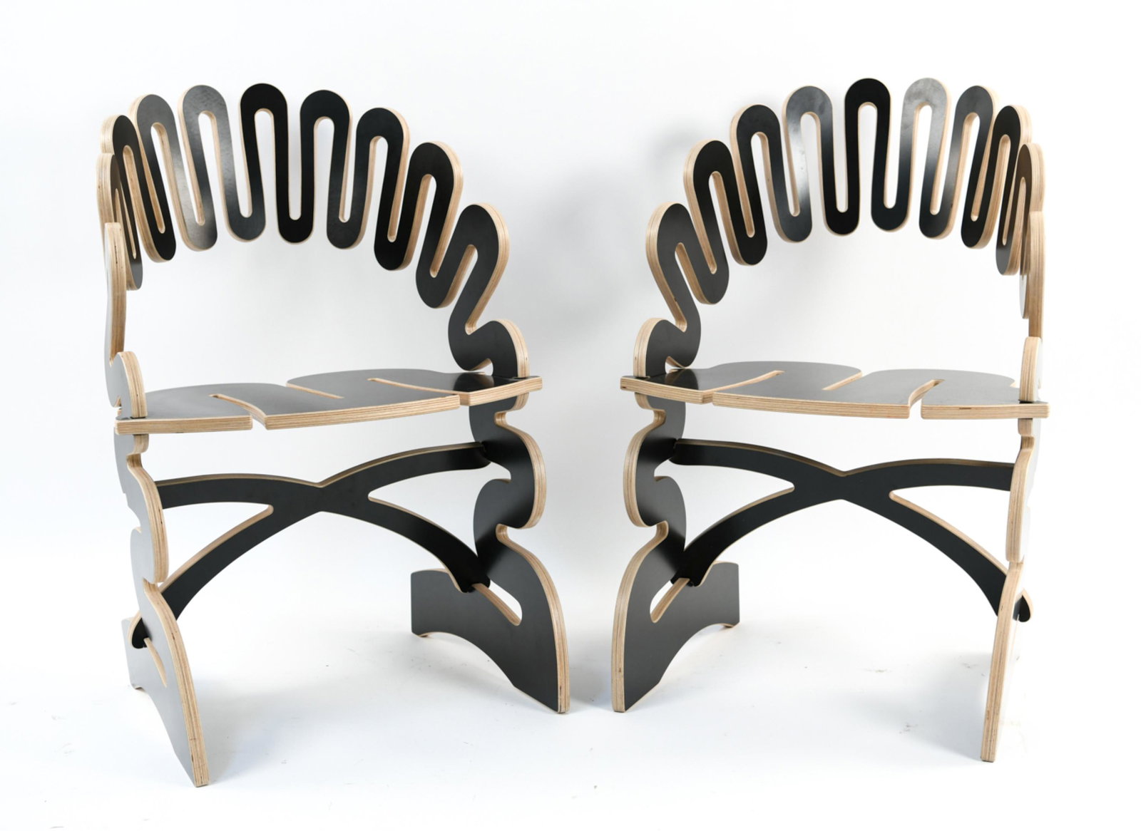 PAIR OF GREGG FLEISHMAN "ALICIA" SCULPT CHAIRS: "Alicia" design. Contemporary. Signed on back of stretcher. Cut from 12-ply Finnish birch and formica. Numbered 3/4 and 4/4, '07. Dimensions: H 33" x W 20.5" x D 20" x SH 17.5" Condition: Minor superf