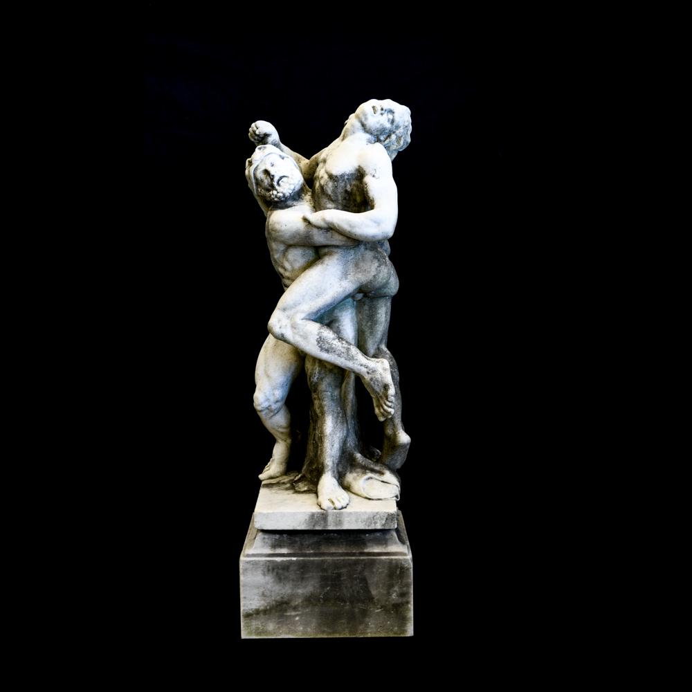 19TH CENTURY HERCULES LIMESTONE SCULPTURE: Late 19th Century outdoor sculpture. Classically carved limestone sculpture depicting two men, assumable Hercules with the Namean lion cloak. Dimensions: H 46" x W 14.5" x D (overall) Condition: Signs