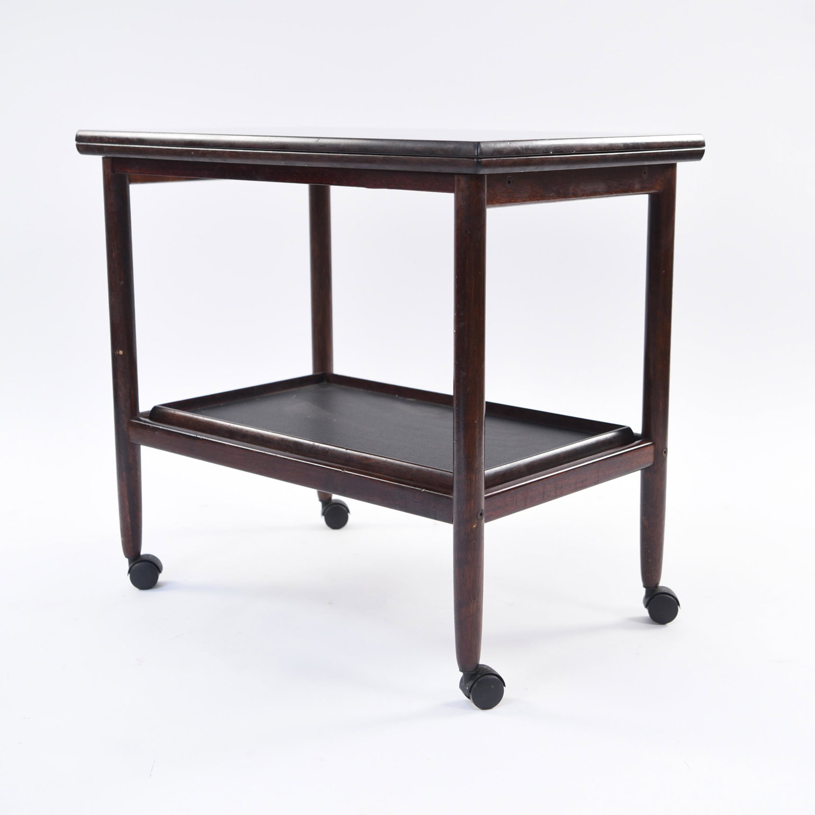 DANISH ROSEWOOD SERVING CART: Top flips open. Andels Mobel Magasinet paper label under. Dimensions: (Closed) H 25" x W 27.5" x D 17.25" (Open) W 34.75" Condition: Some rubs and scratches consistent with age and use. E053