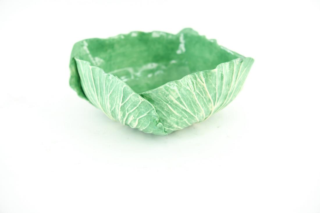 DODIE THAYER CABBAGE BOWL: Marked on bottom. Dimensions: H 4" x W 9" x D 9" Condition: Chips with old restorations to edges.