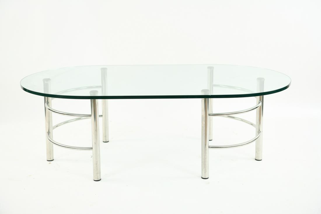 GLASS AND CHROME COFFEE TABLE: Dimensions: H 17" x W 51.5" x D 27.5" Condition: Showing light wear consistent with age and use.
