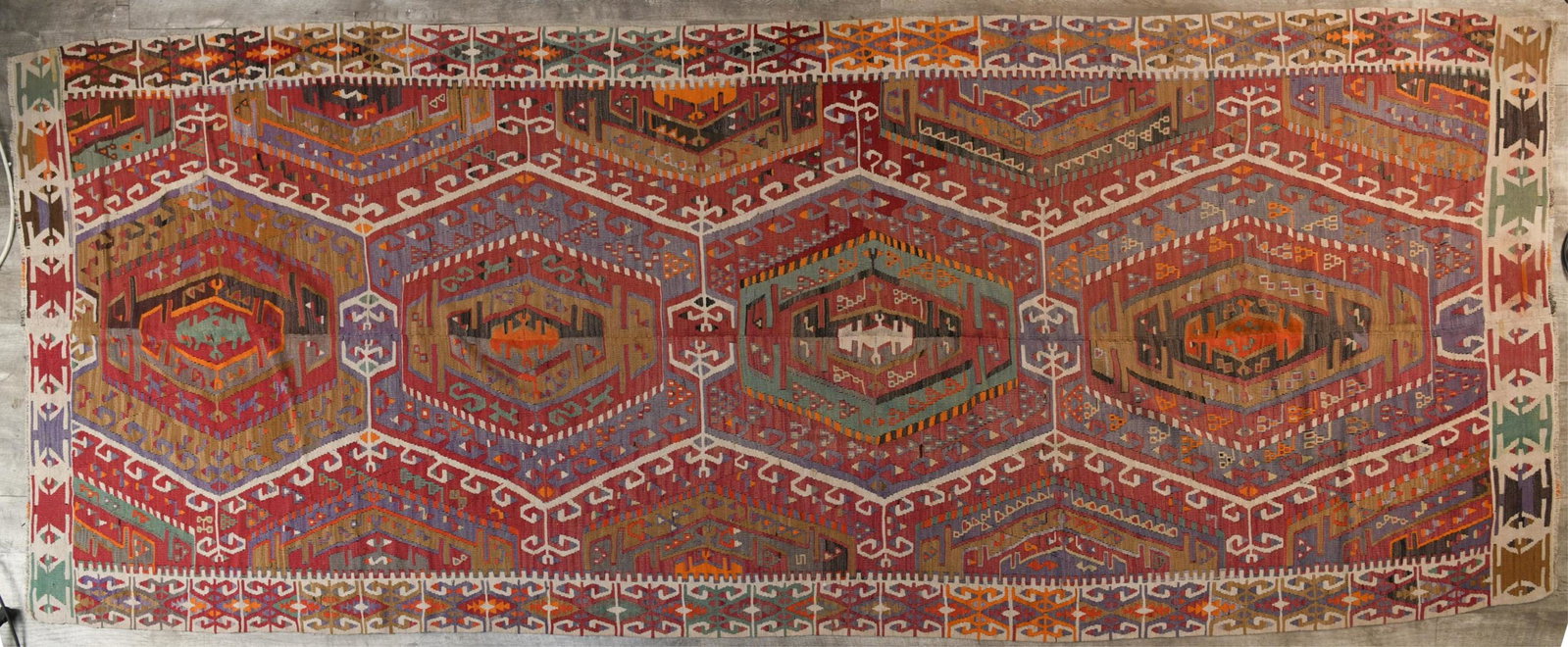 ANTIQUE (TURKISH) ANATOLIAN KILIM RUG: Dimensions: W 150 " x D 59 " Condition: Light fading. Minor fraying.