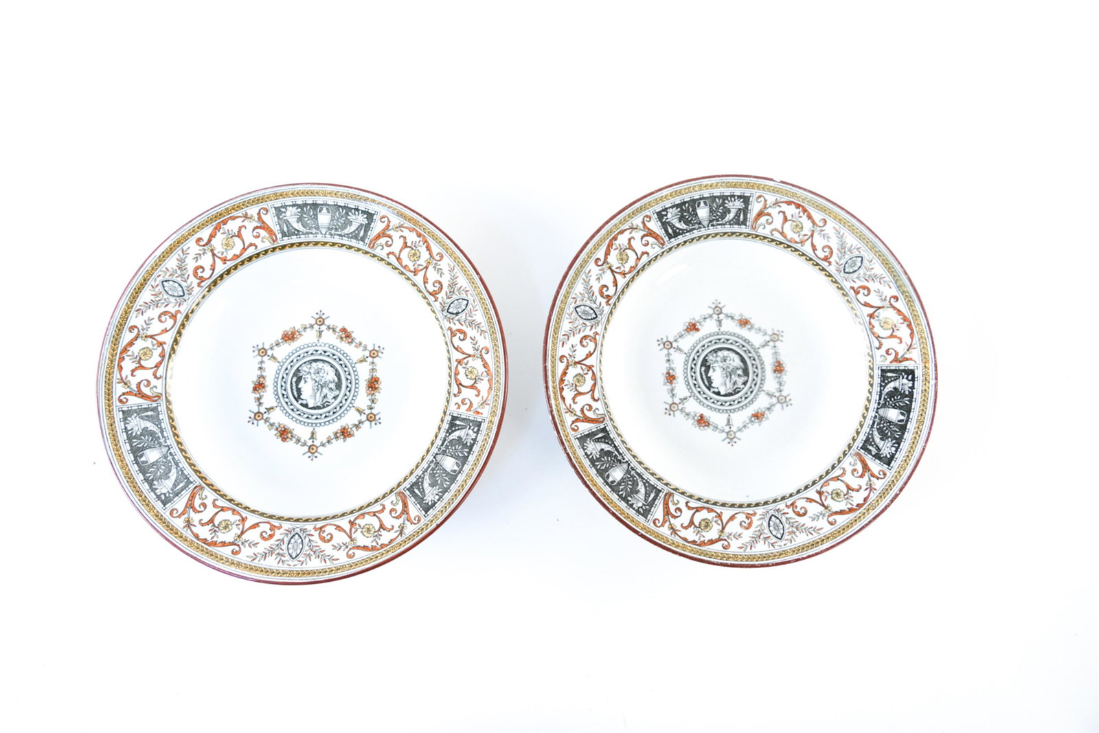 (2) MINTONS PORCELAIN PLATES: Marked underneath: Mintons Clare Dimensions: H 1.75" x Dia. 10.5" Condition: Crazing, chips, surface wear, and crack to one.