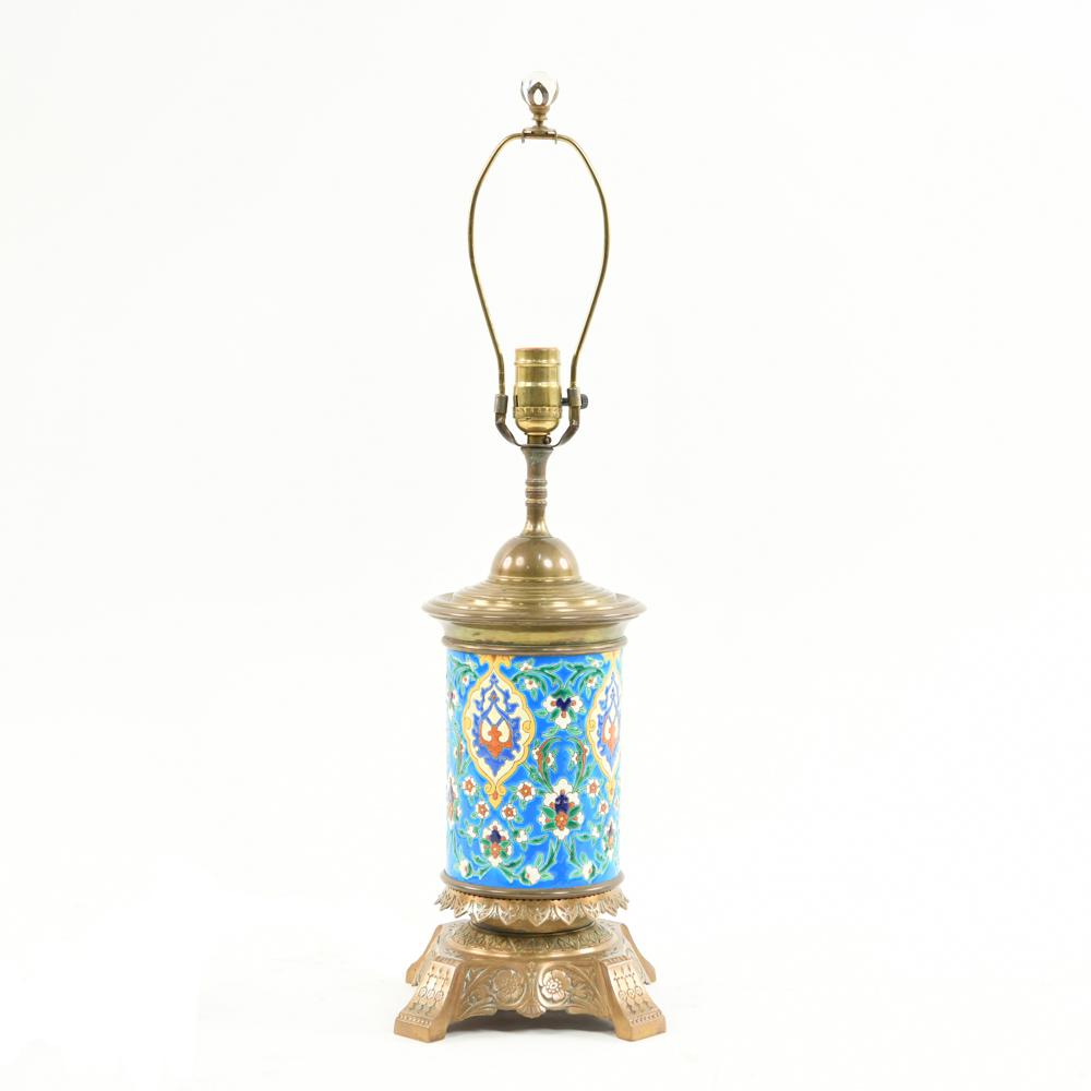 LONGWY AESTHETIC MOVEMENT ISLAMIC REVIVAL LAMP: On aesthetic movement bronze base. Dimensions: H (to socket) 18.5" x W 7" x D 7" Condition: Untested. Remains of polish in recesses.