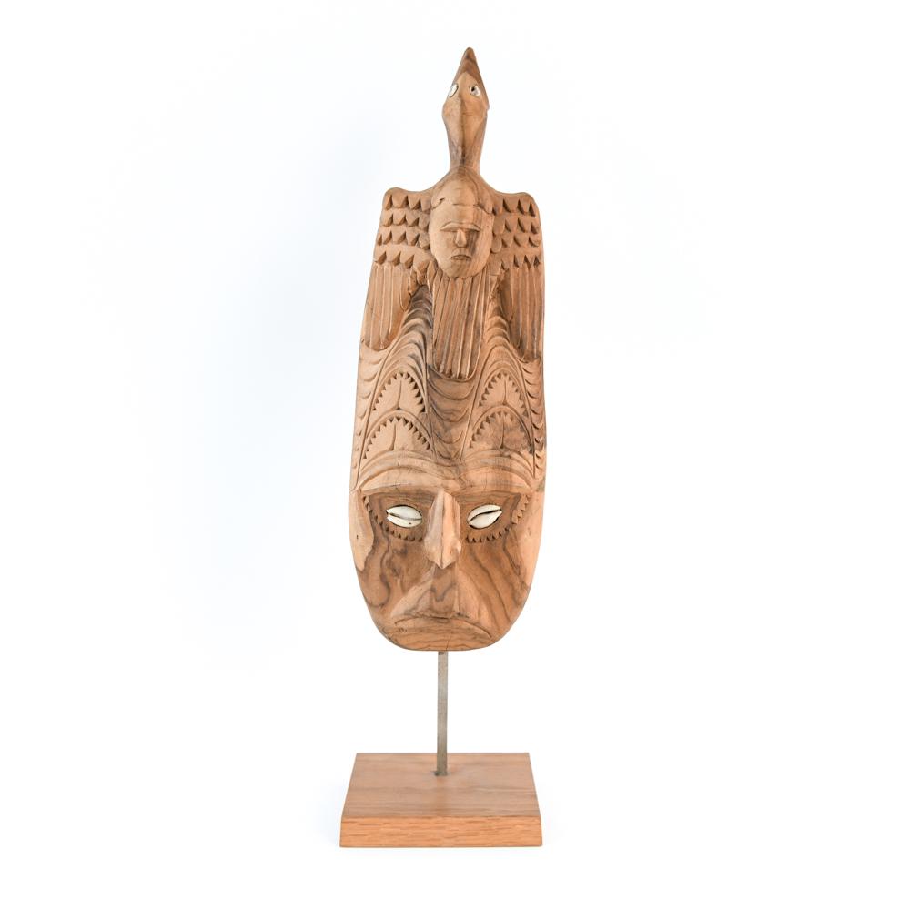 CARVED WOODEN MASK ON STAND: Dimensions: H 22" x W 5.5" x D 4.25" Condition: Minor splits to wood. Small repair to seashell eye.