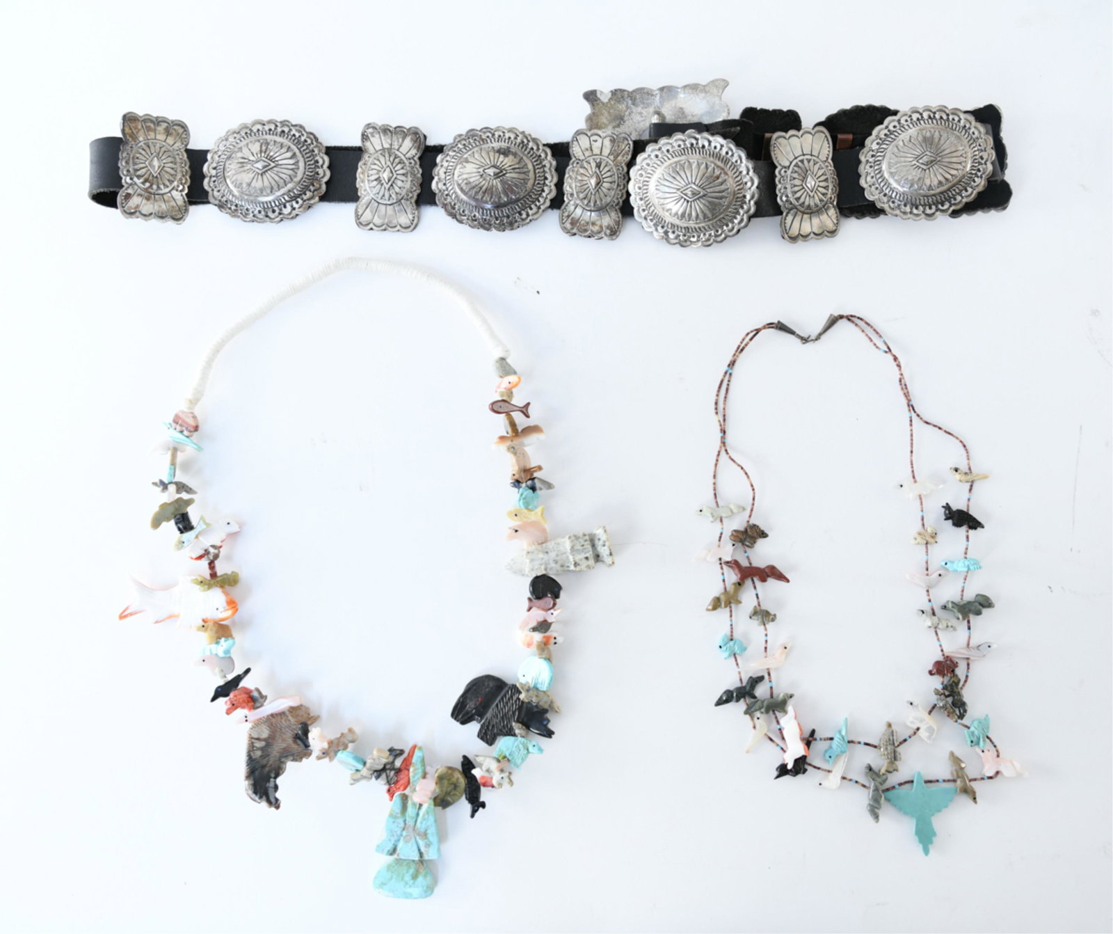 NAVAJO BELT AND JEWELERY GROUPING: Dimensions: (Largest) H 3" x W 47.5" Condition: Wear appropriate with use.