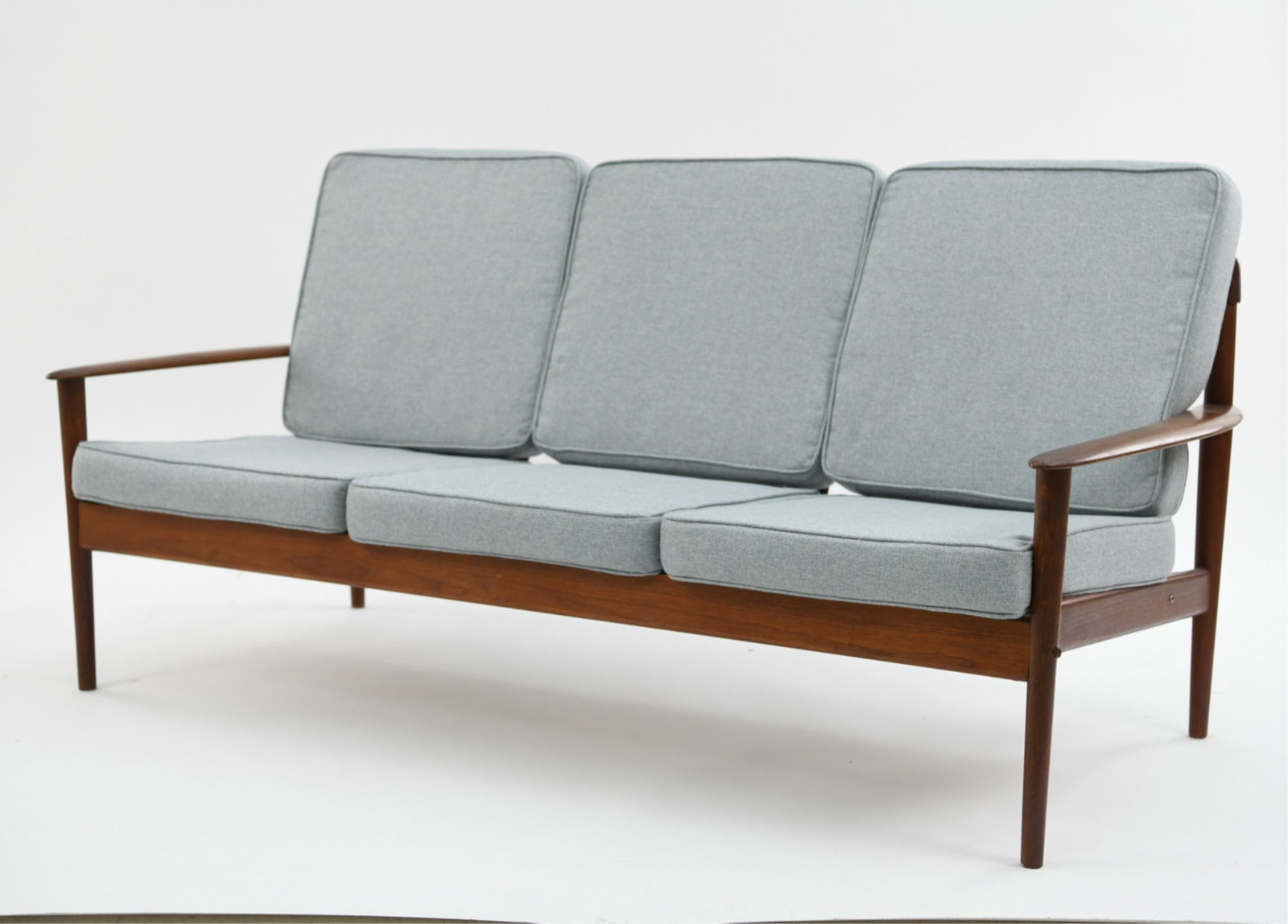 DANISH MID-CENTURY TEAK THREE SEAT SOFA: With Danish label under. Dimensions: H 33" x W 70" x D 32" SH: 16.5" Condition: Minor signs of age and use, clean upholstery.