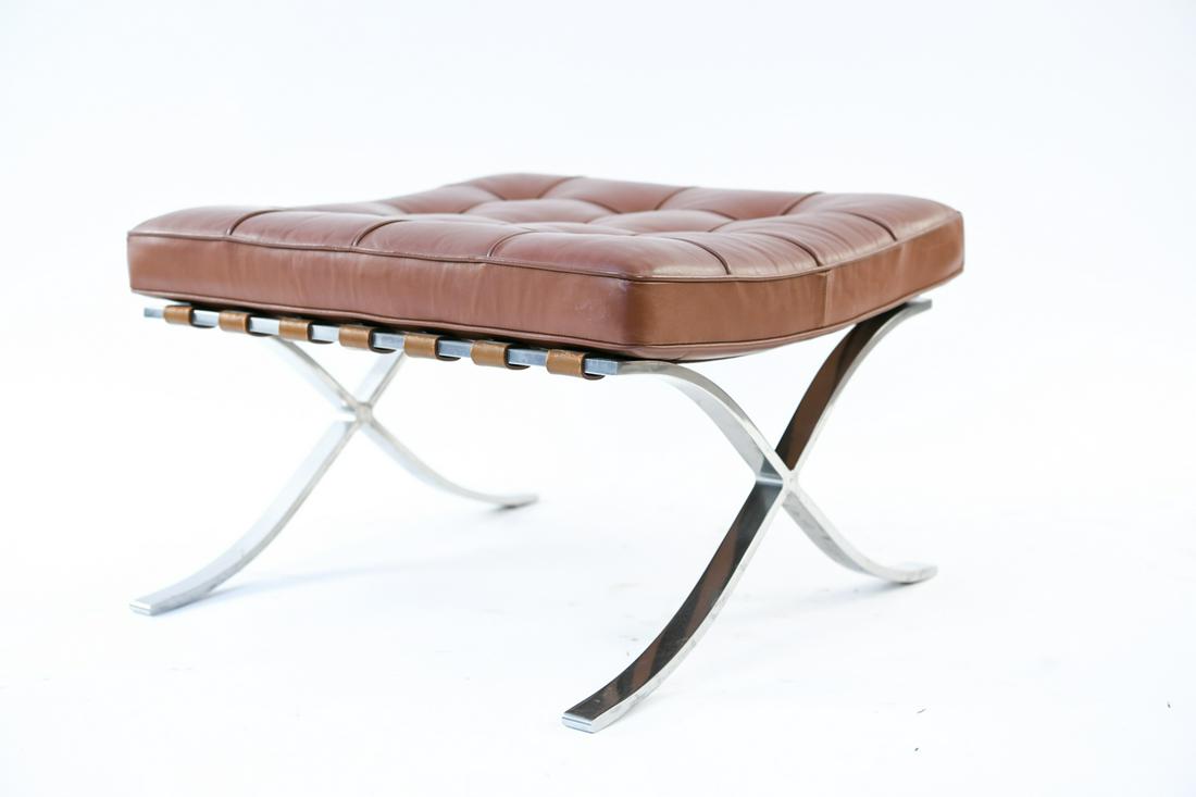 BROWN LEATHER KNOLL BARCELONA OTTOMAN: Tagged; Knoll North America Inc. Dimensions: H 14.5" x W 25.5" x D 24" Condition: Stain spot to seat. Few cracks to leather.