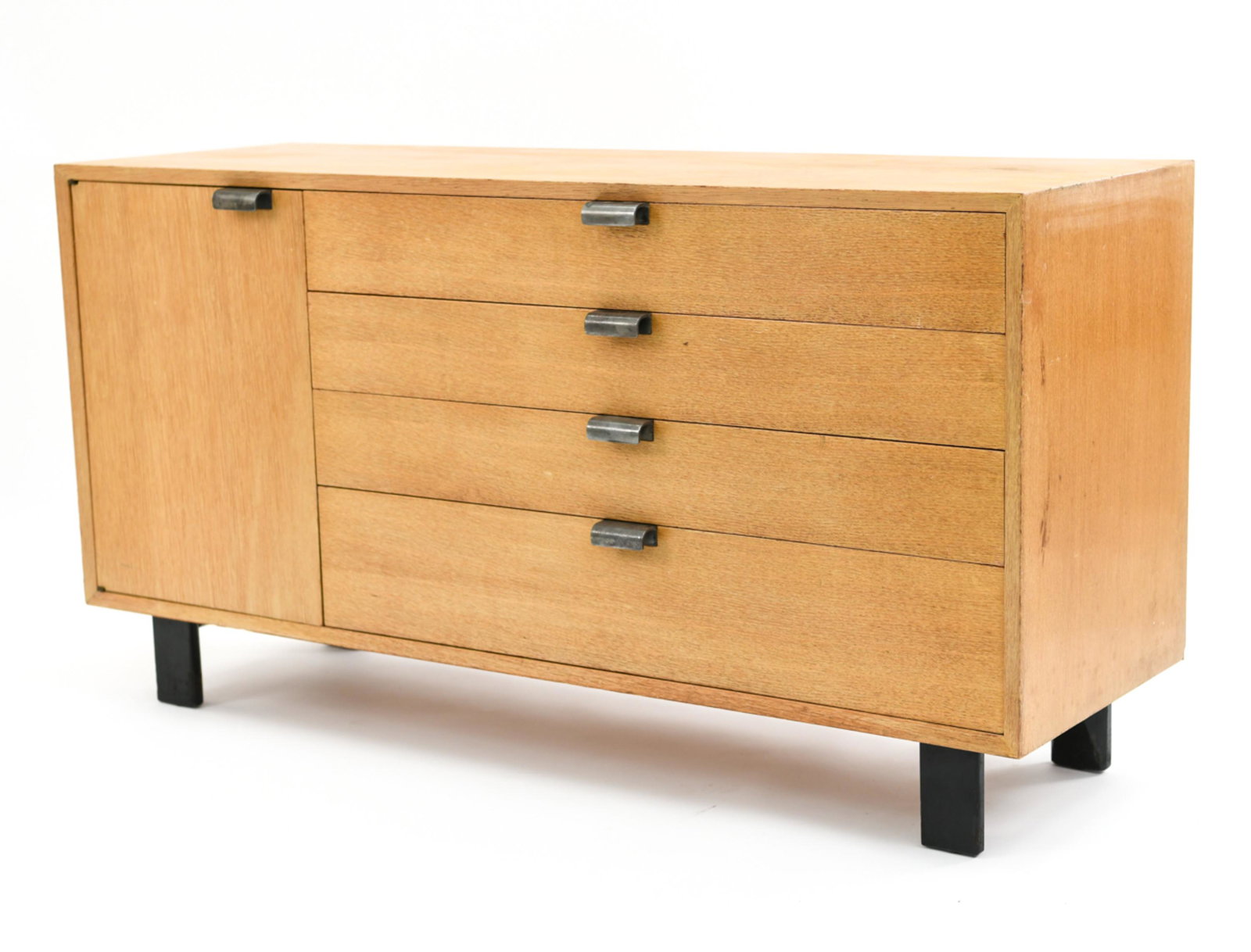GEORGE NELSON FOR HERMAN MILLER DRESSER: Ash, with original feet and hardware. Dimensions: H 30.25" x W 56.25" x D 20" Condition. Signs of use including uneven finish, nicks to edges. Watermarks to top surface.