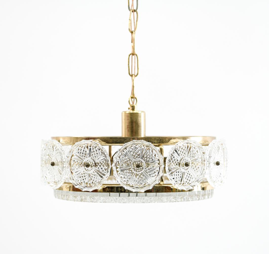 ORREFORS BRASS AND GLASS PENDANT CHANDELIER: Dimensions: H 7.5" x D 14" Condition: Small chip to one glass "medallion". Light brass finish wear. H100