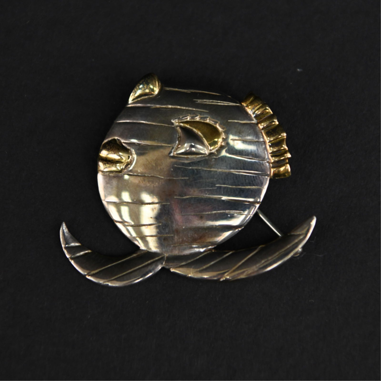 JOHN LENNON "A FISH BLINKING" FISH PIN: Sterling silver, signed and hallmarked on back, comes in original case. Dimensions: L 1.75" x W 1.5" Weight: 0.50 ozt Condition: Showing light signs of use.