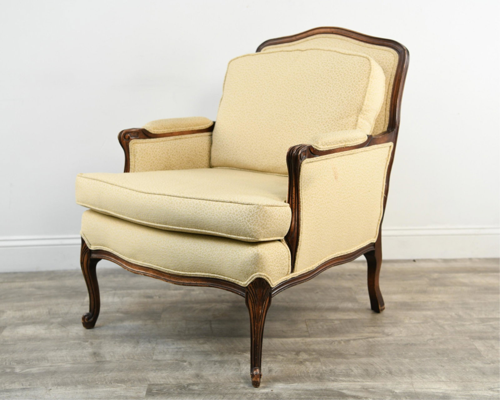 FRENCH STYLE BERGERE CHAIR: Dimensions: H 35.5" x W 26" x D 33" x SH 18.5" Condition: Soiling to upholstery. Finish wear and rubbing to wood. Nicks and dings to edges, some scuffs to feet.