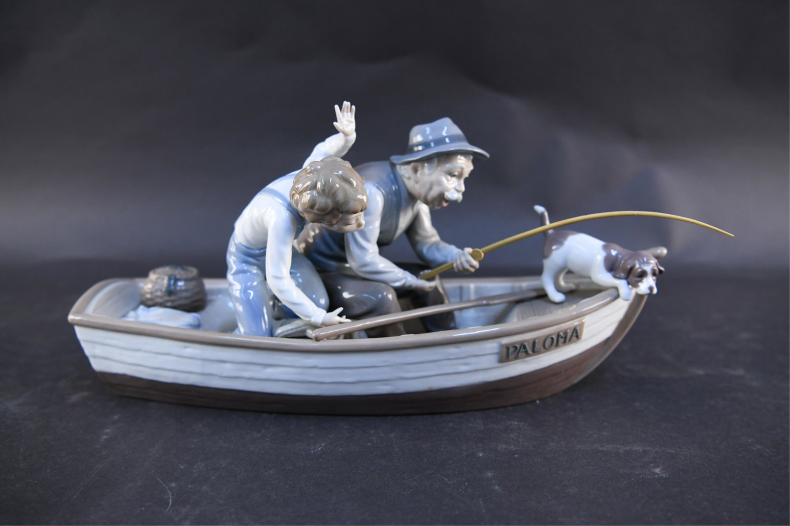 LLADRO FISHING WITH GRAMPS 5215: Lladro Fishing with Gramps 5215. Original box included. Dimensions: (Box) H 11" x W 10.5" x D 22.5" Condition: Repairs to figures and fishing pole.