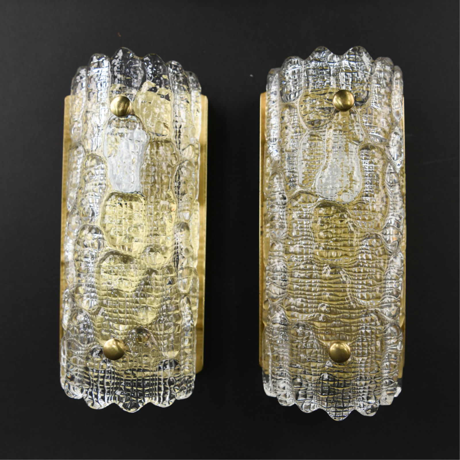 PAIR OF CARL FAGERLUND FOR ORREFORS SCONCES: One with Lyfa decal on verso. Dimensions: (Each) H 11." x W 4.5" x D 3.5" Condition: Remnants of plaster on verso and wiring from previous installation. Minor signs of finish wear to brass. H093