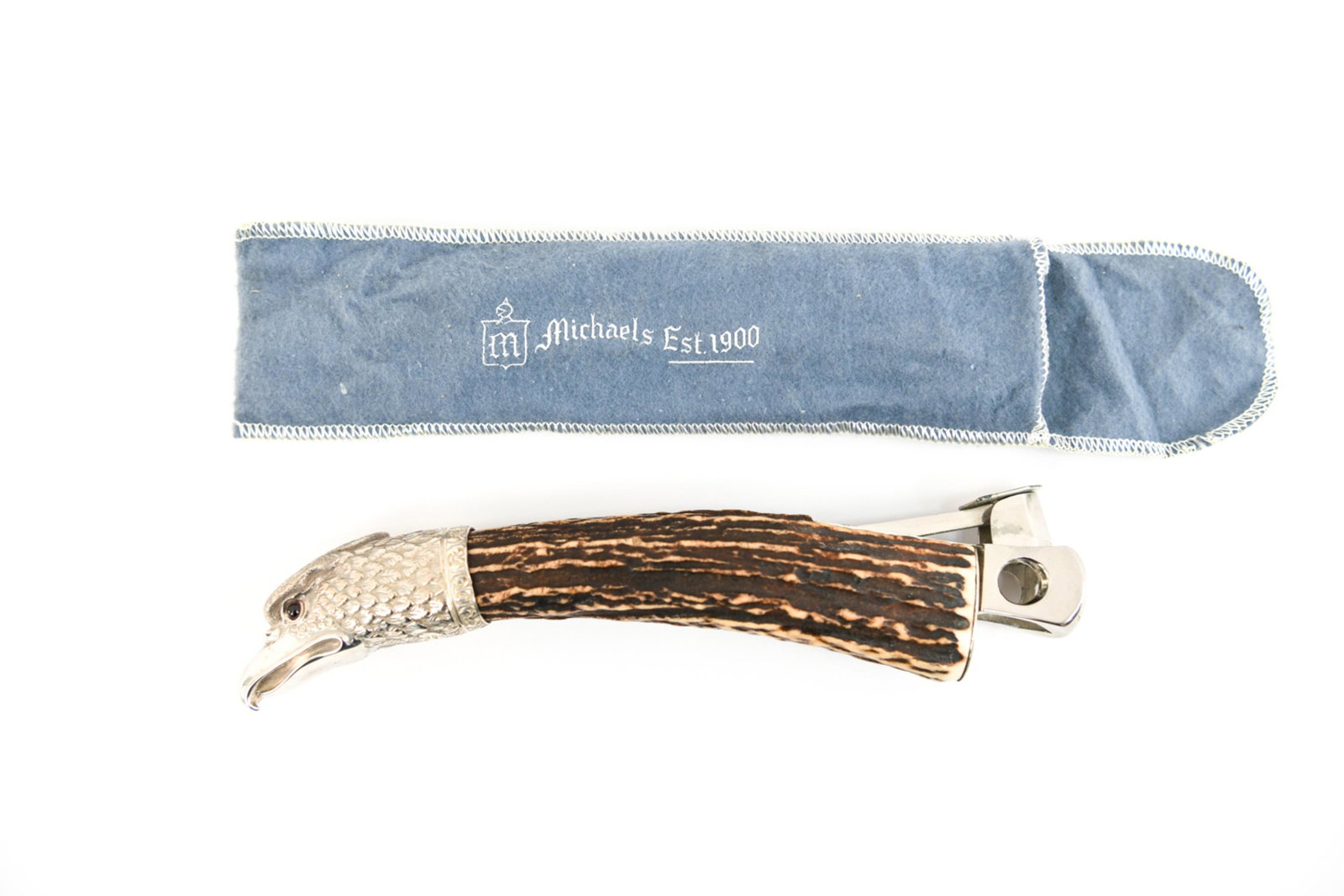 MID-20TH C. STERLING EAGLE CIGAR CUTTER: Marked made in Western Germany on cutting mechanism. Hallmarked 925 on eagle. Dimensions: L 8" Condition: Showing minor signs of age.