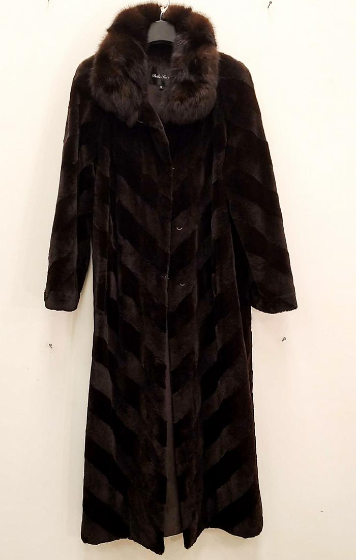 FULL LENGTH BROWN MINK SHEARLING COAT: Belle Fare. Size 10. Diagonal striped pattern with fur collar. Dimensions: L 53", (Armpit to armpit) 23", Sleeve 24" Condition: Used, showing minor signs of use including light wear to sleeve.