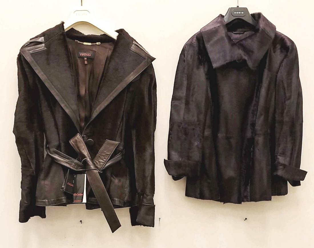 (2) DESIGNER FUR JACKETS: Including: one brown Escada calf skin & leather belted jacket, size 42; one purple lambskin silk-lined jacket by Akris, size US 14. Dimensions: (Purple) L 23", Armpit to armpit 19", Sleeve 19" Conditi