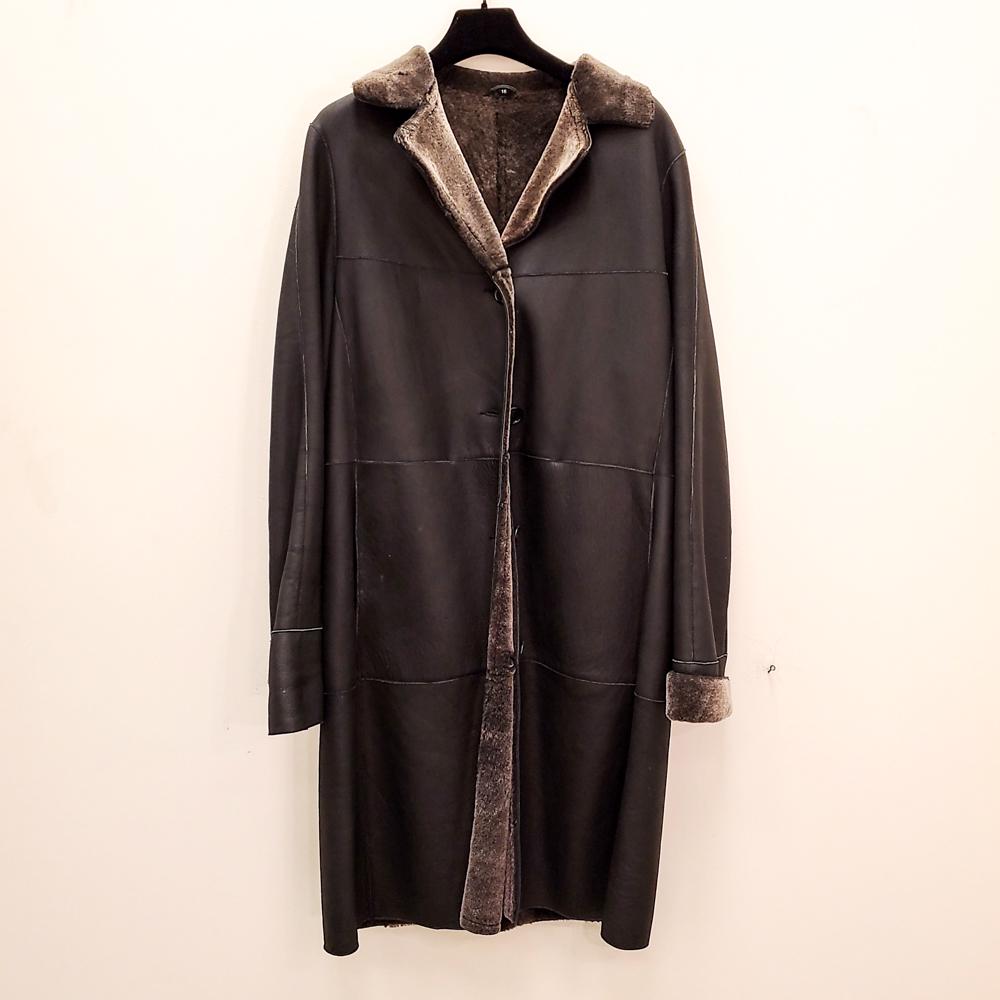 BURBERRY LADIES FUR & LEATHER COAT: Mid-length. 100% shearling. Size 16. Patchwork black leather exterior. Condition: Showing light signs of use including minor scuffs at pockets.