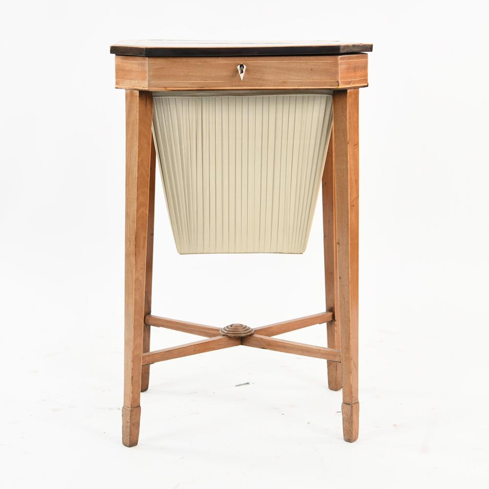 ANTIQUE MANNER OF BIEDERMEIER SEWING TABLE: Dimensions: H 29" x W 18.5" x D 14.5" Condition: Surface splits. Minor nicks and scratches.