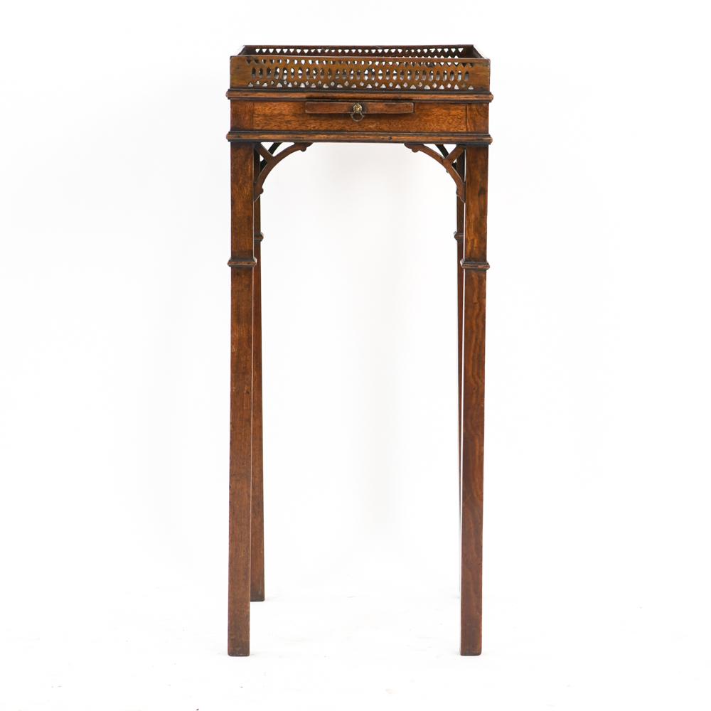 ANTIQUE TELEPHONE STAND TABLE: Carved wood gallery. Dimensions: H 29" x W 12" x D 12" Condition: Some surface marks. Tray sticks. Wear consistent with age and use.