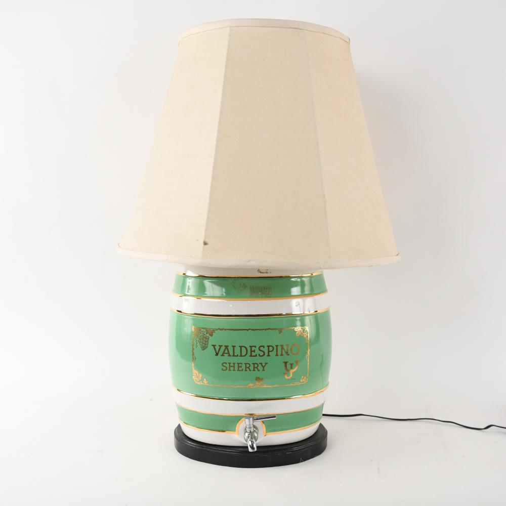 PORCELAIN SHERRY DECANTER CERAMIC LAMP: Dimensions: (Including shade) H 29.5" x Dia. 19.5" Condition: Few small stains to shade. Tears to inner lining of shade. Untested. Some residue to ceramic. Minor nicks to wood base.