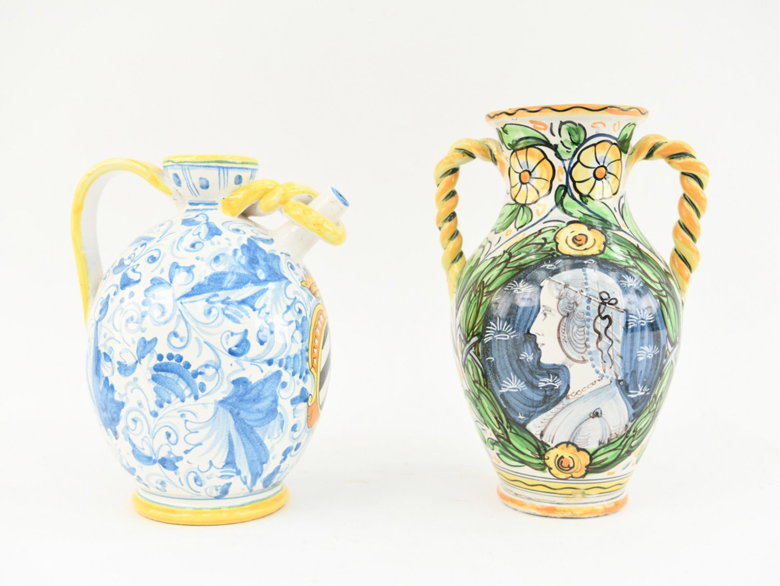 (2) MODERN RENAISSANCE STYLE ITALIAN CERAMICS: Larger marked Italy 622. Tin glazed, hand painted vessels. Both marked underneath. Dimensions: (Larger) H 13" x W 8.75" x D 7.5" Condition: Crack to glaze at spout of jug. Handling wear. Couple glaze 