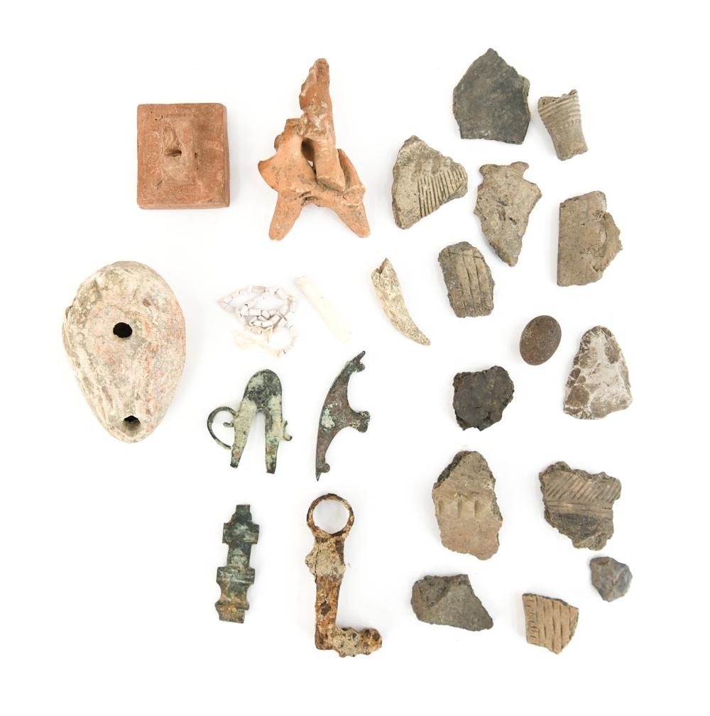 ANCIENT MIDDLE EASTERN ANTIQUITIES: Includes: fragmentary ancient Greek figure on horse, Holy Land oil lamp, bronze and iron fittings, pottery shards, terracotta stamp seal (probably modern). Dimensions: (Lamp) L 3.5" Condition: Breaks,