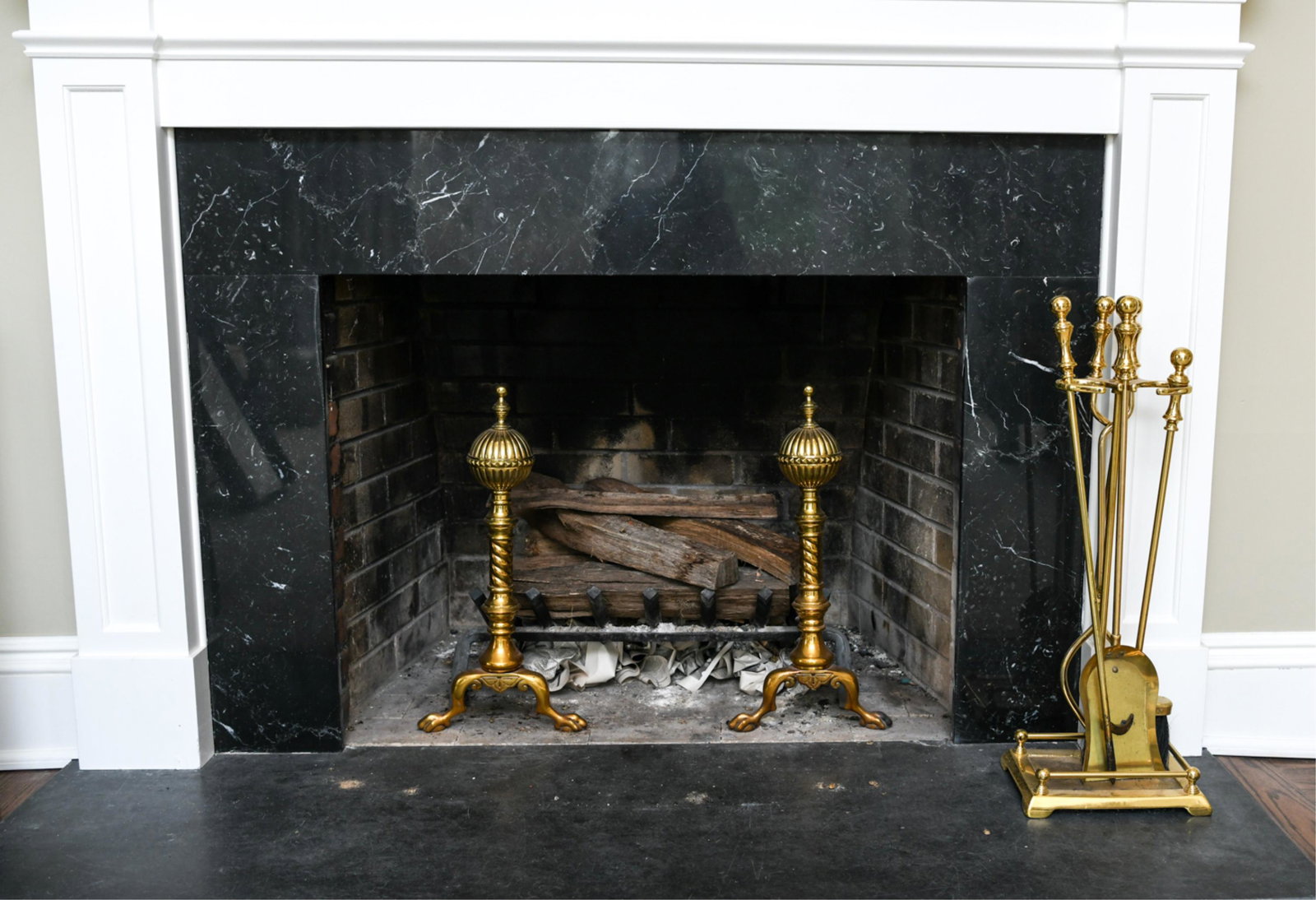 VINTAGE FIREPLACE SET: Empire style andirons, fire tools, and fire tool stand. Brass. Dimensions: (Tools on stand) H 29" x W 10" x D 8" Condition: Some use wear.