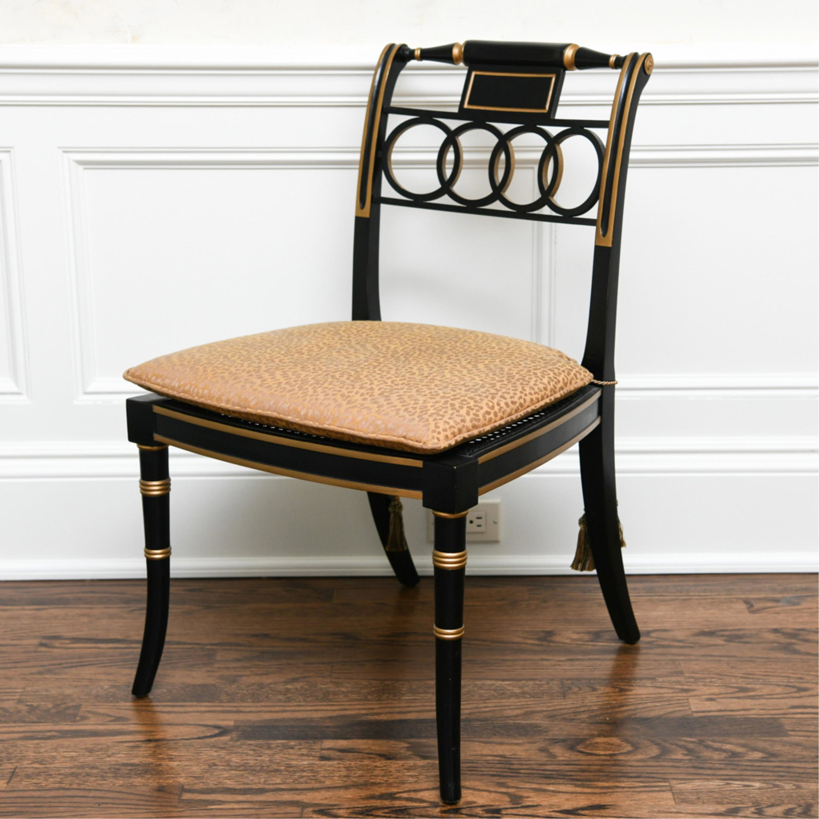 CONTEMPORARY NEOCLASSICAL STYLE SIDE CHAIR: Baker Furniture. Painted with gold details and caned seat. Dimensions: H 32.5" x W 20" x D 22" x SH 18" Condition: No issues to note.