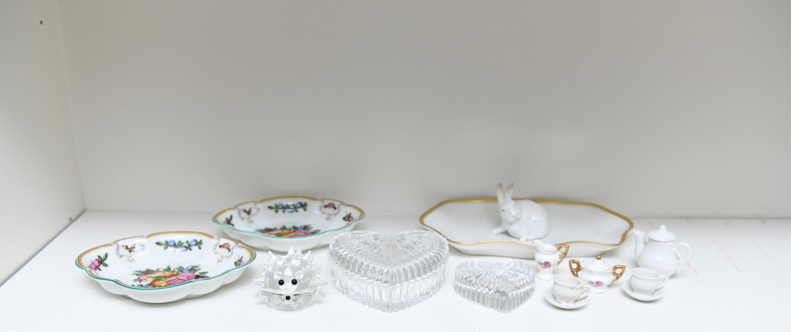 CRYSTAL & PORCELAIN GROUPING: Including crystal hedgehog apparently unmarked, Royal Copenhagen bunny, Limoges, and couple Mottahedeh pieces, etc. Dimensions: (Covered heart dish) H 1.75" x W 4.25" x D 4.25" Condition: One hedgehog