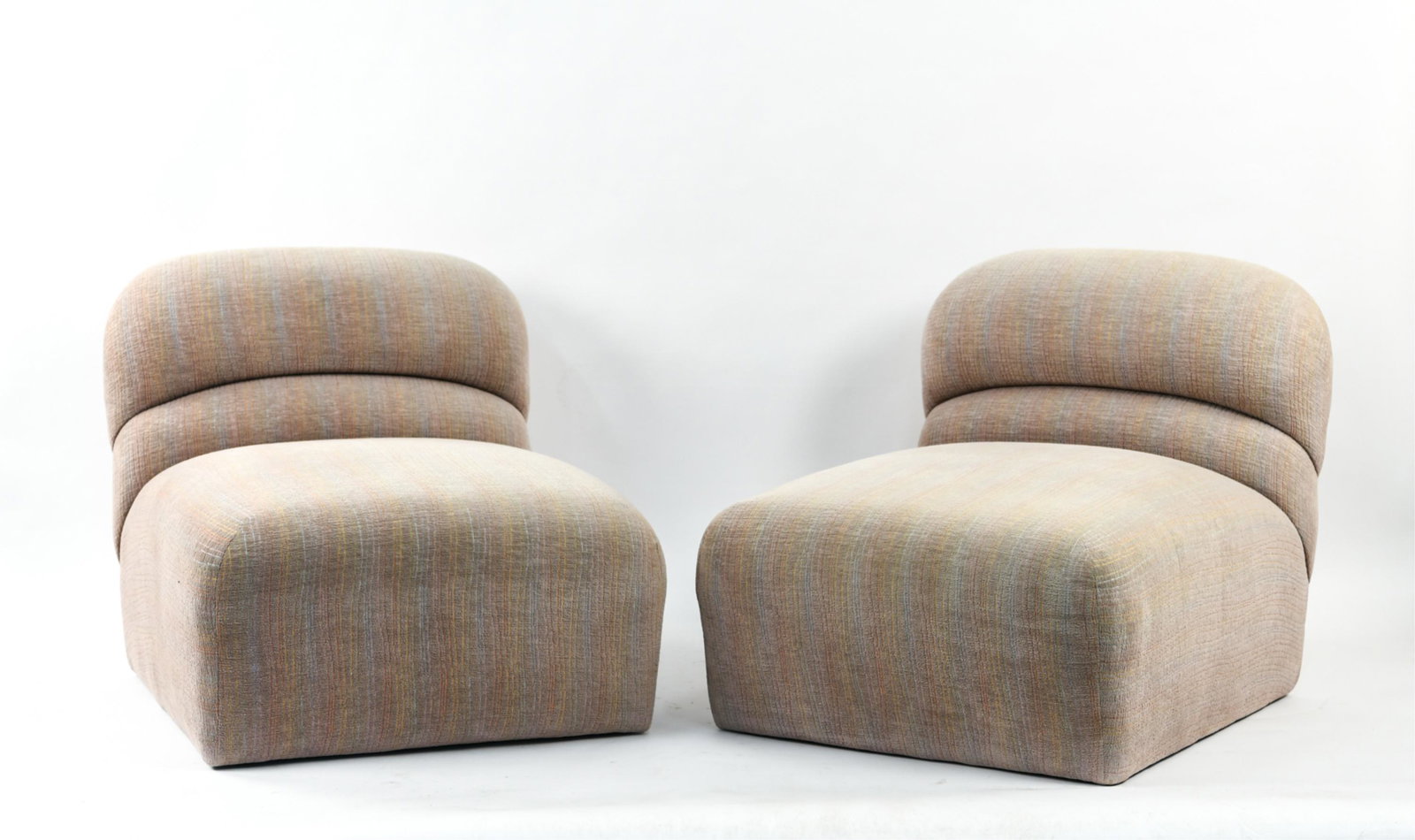 PAIR OF BRUETON SLIPPER CHAIRS: Labeled underneath. Dimensions: H 28.5" x W 29" x D 34" x SH 16" Condition: Minor wear from use including some upholstery fading.