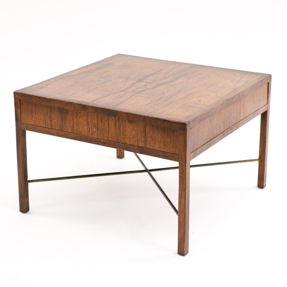 MID-CENTURY ROSEWOOD SIDE TABLE W/ BRASS STRETCHER: Dimensions: H 16" x W 23.75" x D 23.75" Condition: Showing some wear consistent with age and use. Wear to some edges including surface marks.