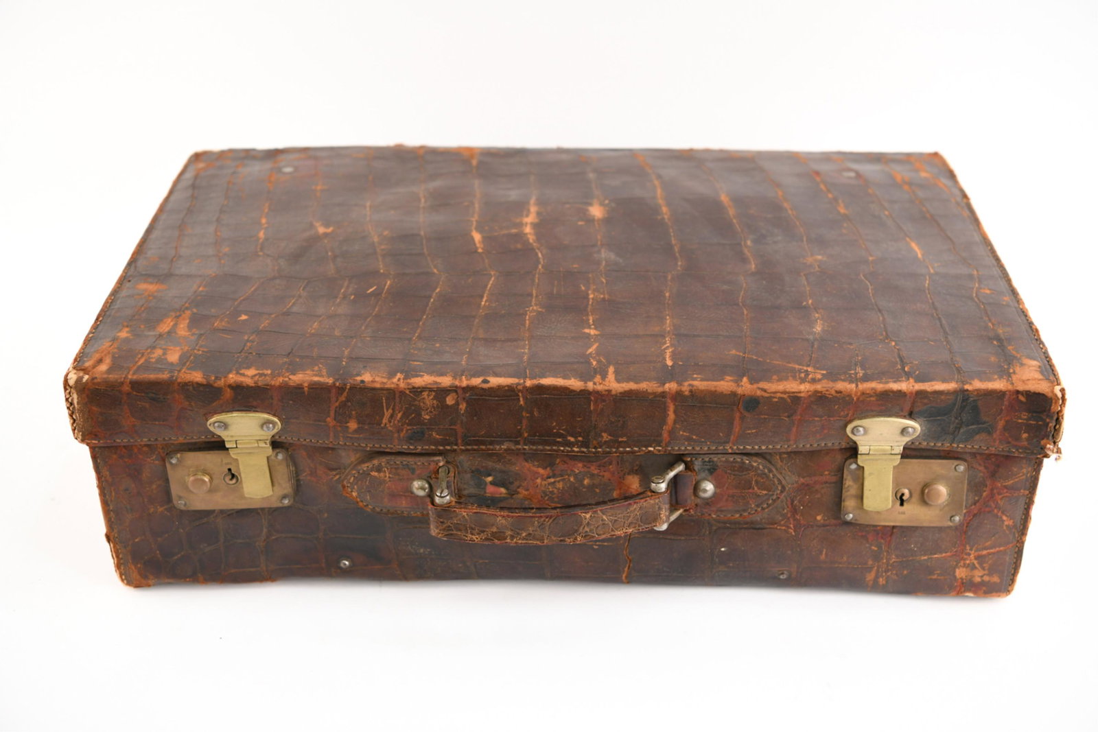 VINTAGE CROCODILE PATTERN LEATHER SUITCASE: Dimensions: 15.5" x W 25.5" x D 7" Condition: Signs of use and age including cracking, tearing and losses.