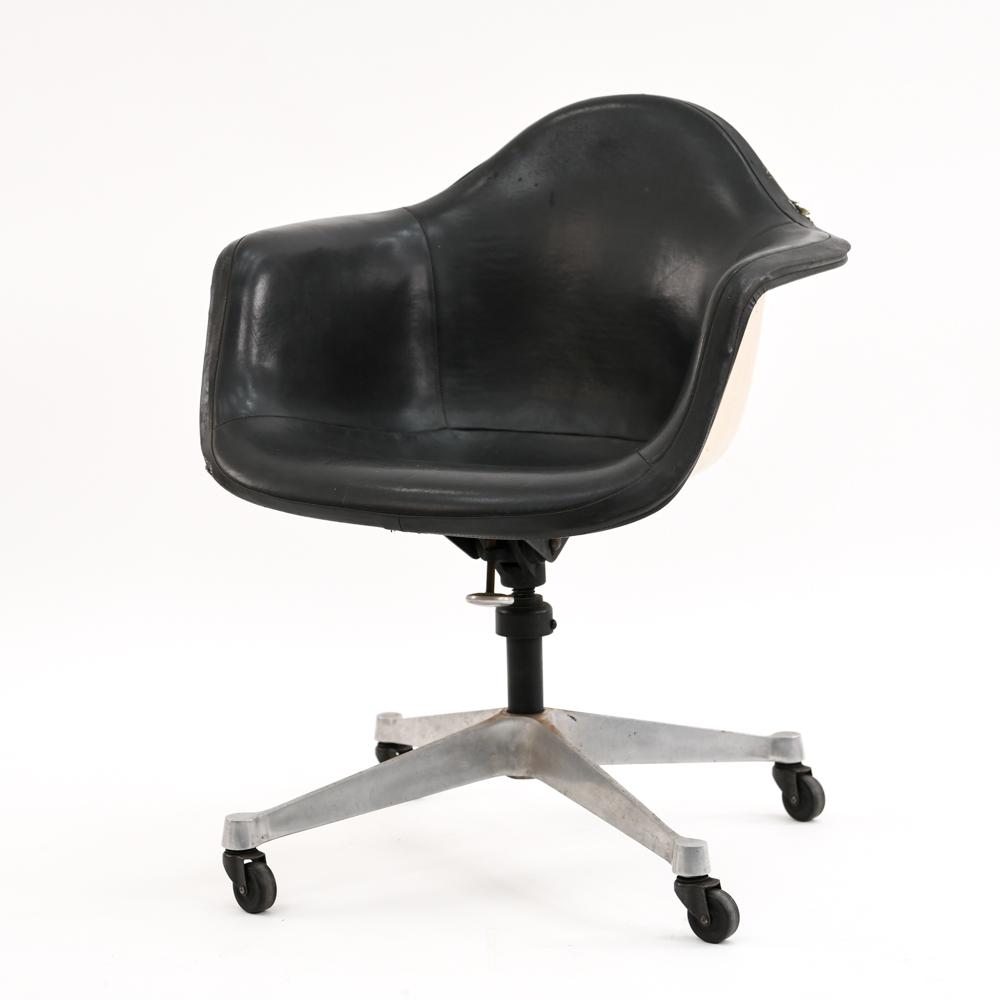 EAMES FOR HERMAN MILLER SWIVEL CHAIR: Dimensions: H 31.5" x W 25" x D 28" S.H. 19" Condition: Some rips and fading to leather upholstery. Pitting to base. Scratches and scuffs to seat.
