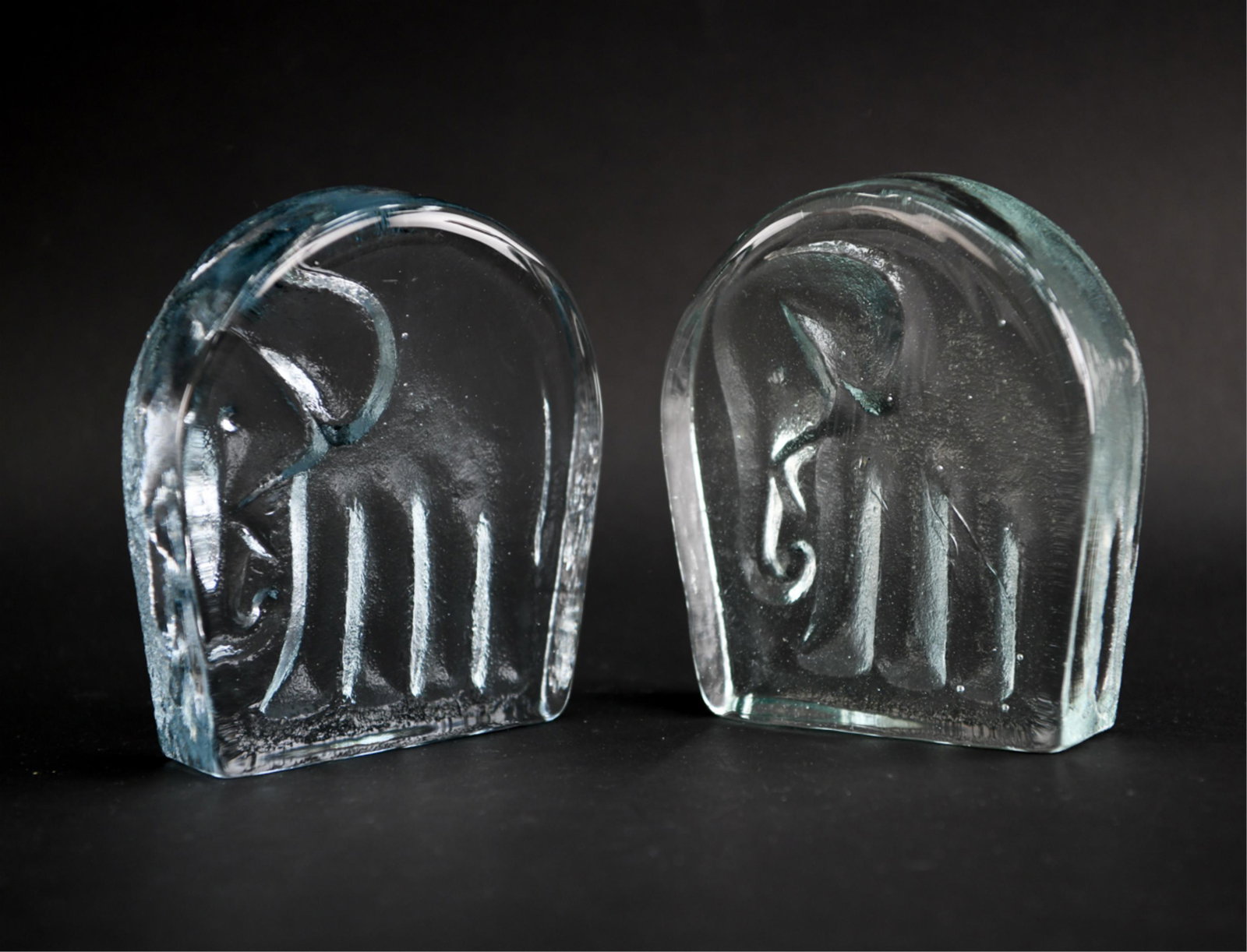 JOEL MYERS FOR BLENKO GLASS ELEPHANT BOOKENDS: Dimensions: H 6.75" x W 5.75" x D 1.75" Condition: Couple light rubs.
