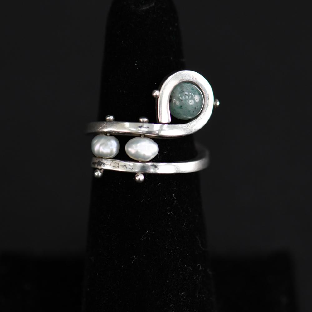 ABSTRACT STERLING SILVER, PEARL, & STONE RING: Sterling silver, chrysoprase and pearl ring. Dimensions: Face: 0.75" Ring Size: 6.5 Condition: Showing light signs of age and use.