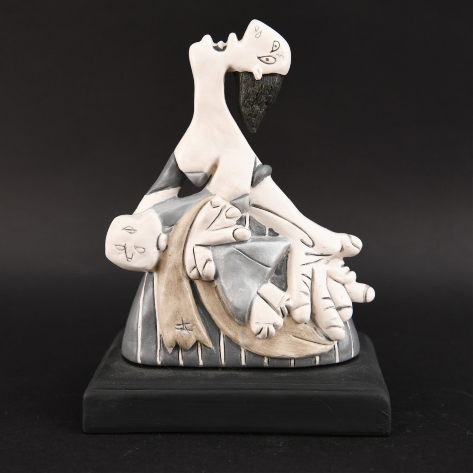 AFTER PICASO'S GUERNICA PAINTED PLASTER SCULPTURE: Unsigned. With metallic paint. Mounted on wood base. Dimensions: H 9" x W 6.75" x D 4.25" Condition: Handling marks including small paint loss on verso.
