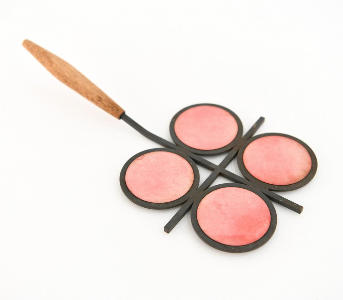 DANISH MID-CENTURY TRIVET: Dimensions: H 2" x W 12" x D 6.5" Condition: Showing some signs of age and use.