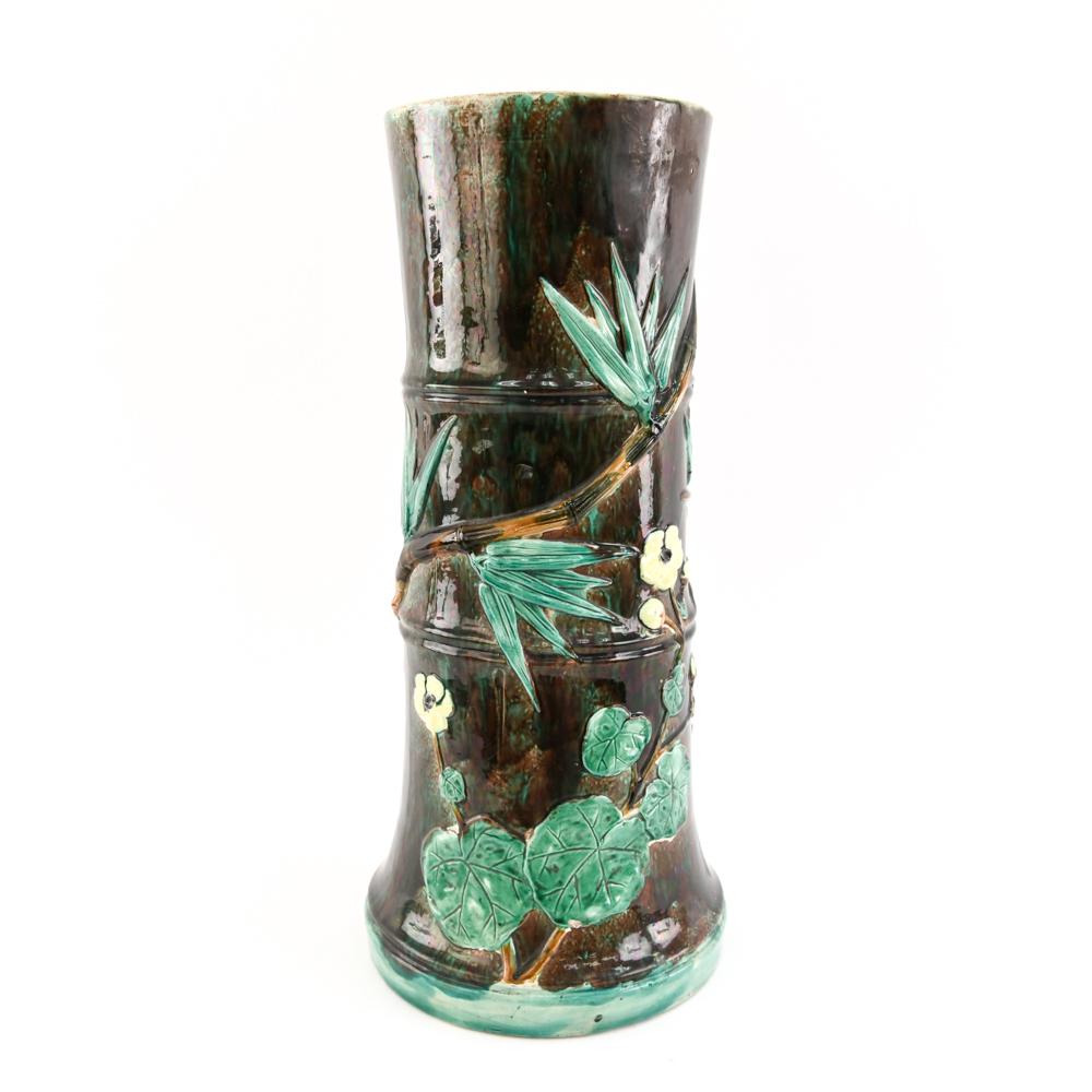 MAJOLICA CHINOISERIE STYLE UMBRELLA HOLDER: Marked J Holdcroft under with water lily and bamboo decoration. Dimensions: H 22.5" x W 10" Condition: 2" repair to glaze along top.