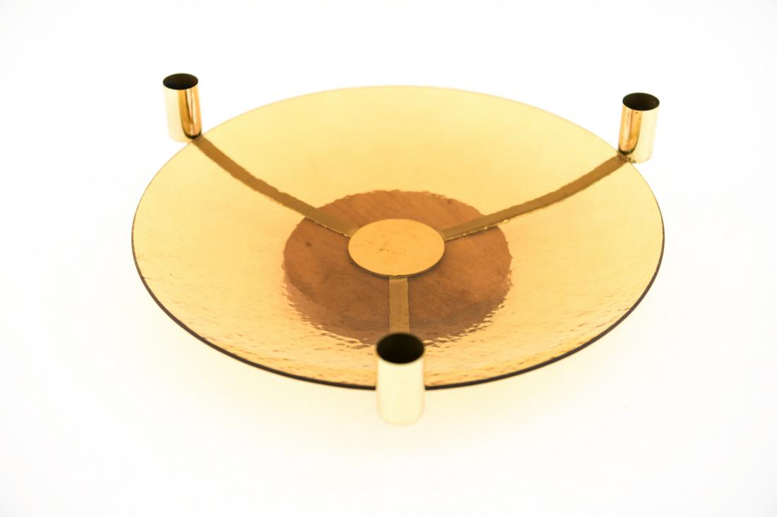 MID-CENTURY GLASS & BRASS CENTERPIECE CANDELABRA: This fun mid-century centerpiece incorporates a yellow textured glass platter which sits upon three brass arms that extend into candle sticks. Underneath is a wooden base. Dimensions: H 4" x Dia. 14"