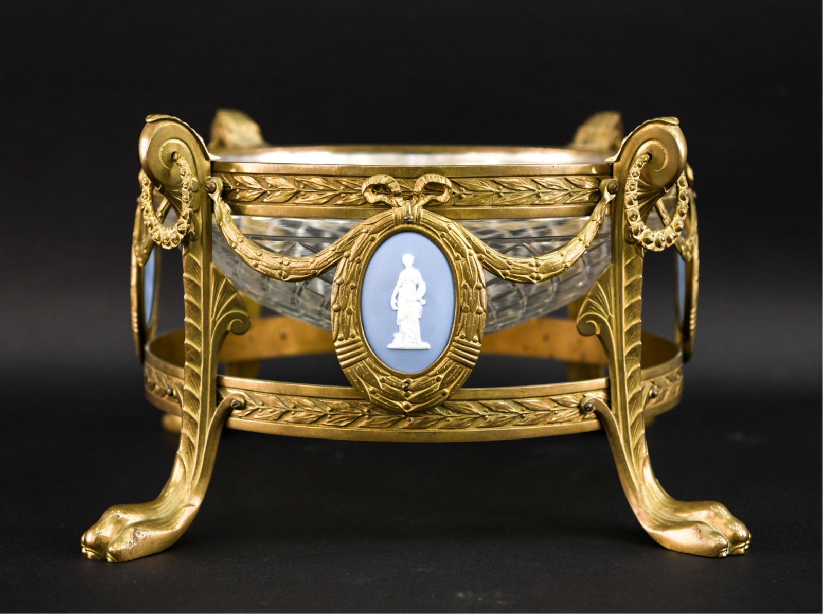 20TH C. FRENCH STYLE ORMOLU CENTERPIECE BOWL: Dimensions: H 9.25" x D 19.25" Condition: Showing some signs of age and use including a crack repair to one porcelain piece.