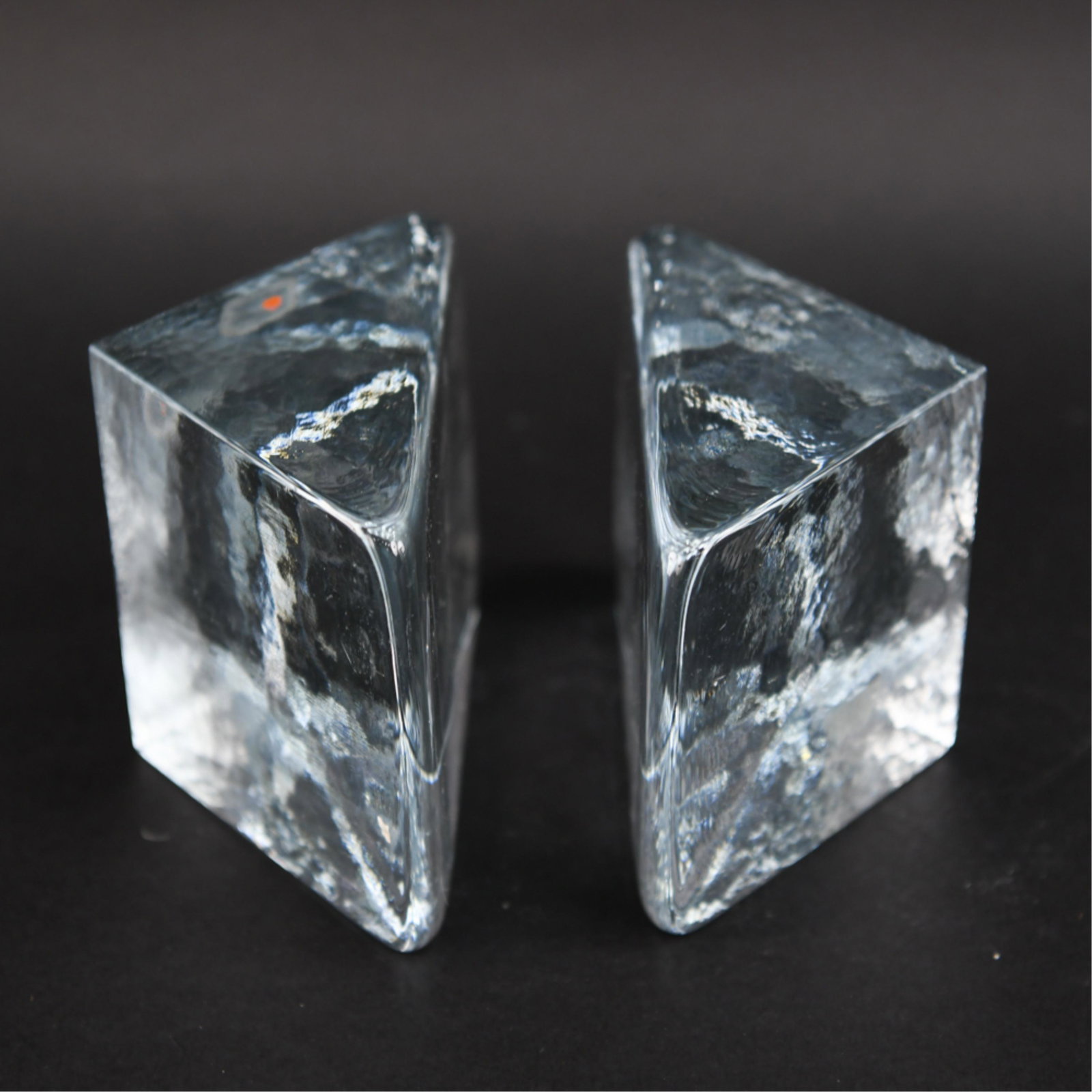 PAIR OF BLENKO ICE BLOCK BOOK ENDS: Marked with decal. Dimensions: (Each) H 4" x W 5" x D 2.75" Condition: Couple light rubs. One half is slightly taller than the other.