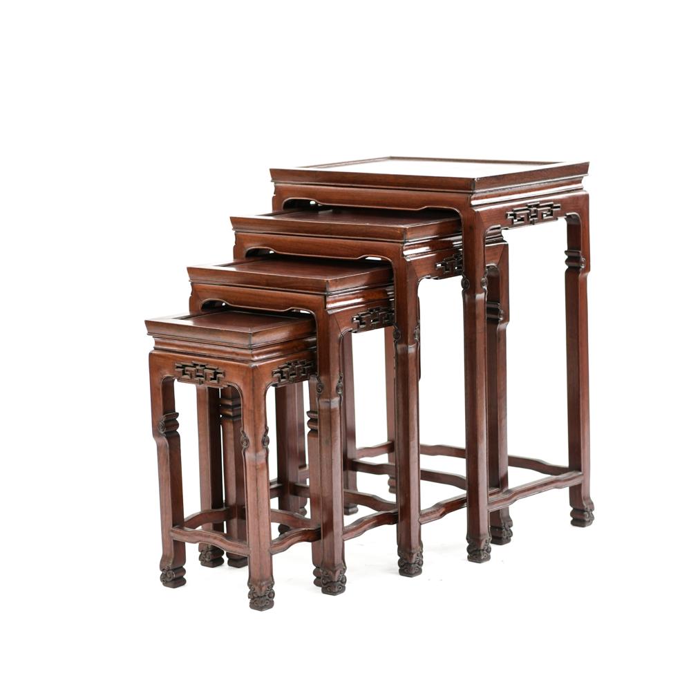 (4) VINTAGE CHINESE ROSEWOOD NESTING TABLES: Carved decoration. Dimensions: H 27.25" x W 19" x D 13.75" Condition: Showing signs of use including some loose trim pieces and a couple small losses. Couple dings.