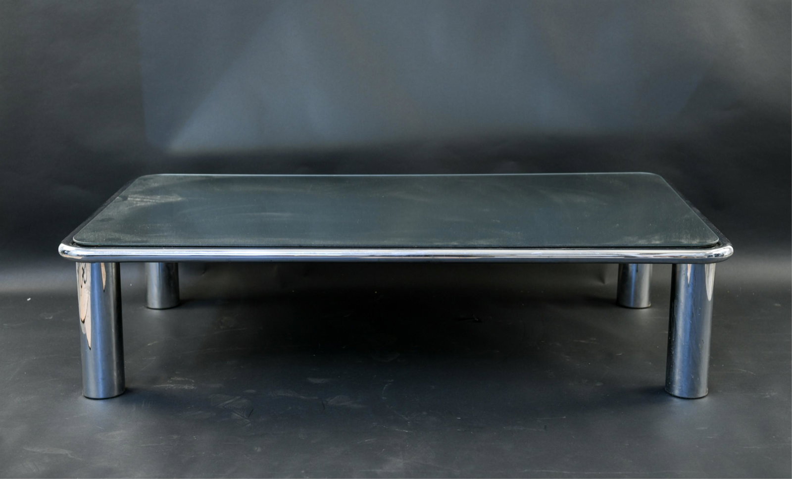 CHROME AND MIRRORED GLASS COFFEE TABLE: Dimensions: H 15.25" x W 61.5" x D 31.5" Condition: Few scratches to glass. Light wear to chrome.